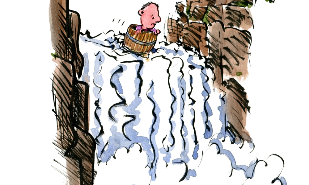 Man in a barrel heading out over a waterfall
