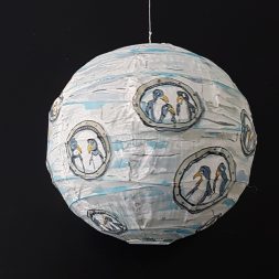 Drawing of a group of penguins inside a sphere ice submarine, painted on rice paper lamp. art by Frits Ahlefeldt